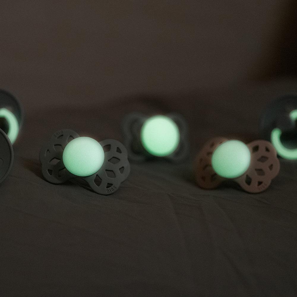 Glow-in-the-dark baby pacifiers for nighttime comfort, soft silicone design