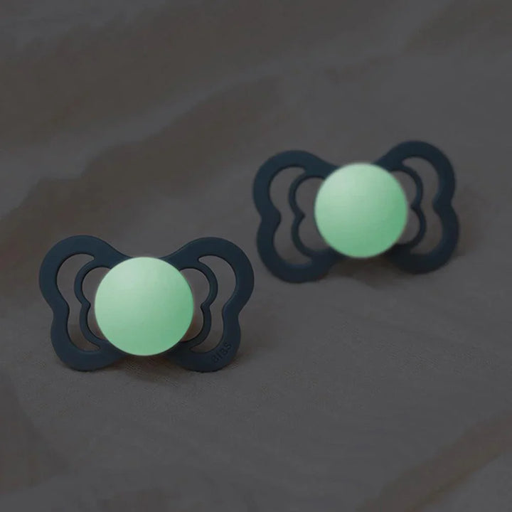 Glow-in-the-dark baby pacifiers with soft silicone design for newborns and infants