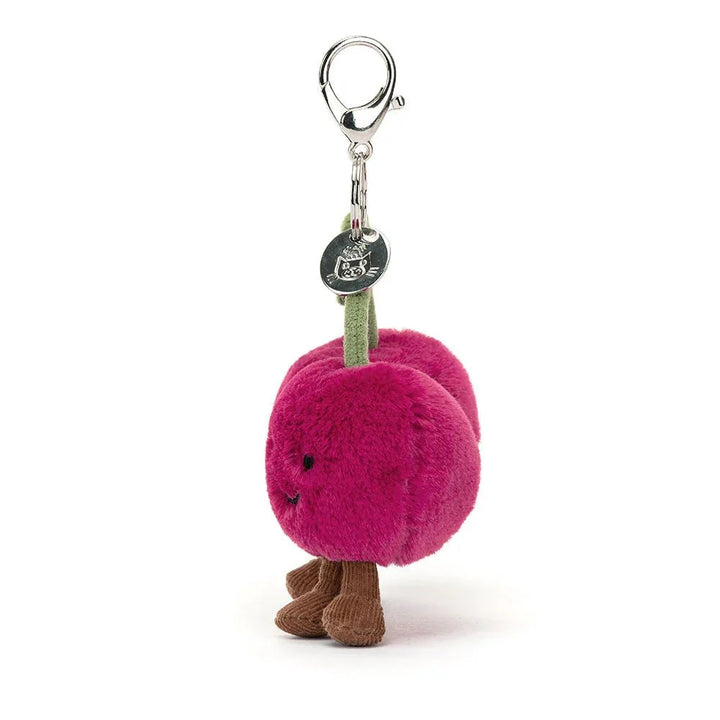 Møkkelig rosa plusskjerpe med grønn stilk og brun sokker, perfekt som barneklær tilbehør