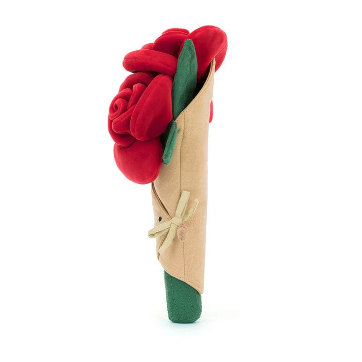 Myk plysrose i beige papir med grønne blader, perfekt barneleketøy og gave