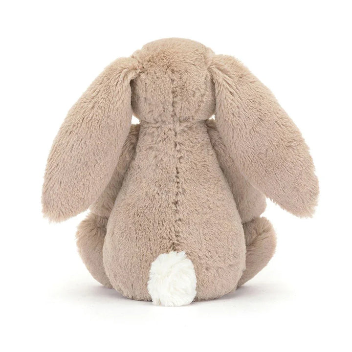Myk beige kaninpynt med hvit hale, perfekt som barneklær eller babyutstyr for små barn.