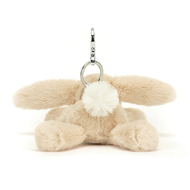 Myk beige kanin nøkkelring med hvit pommepom og metallhake, perfekt som babygave eller barneklær tilbehør