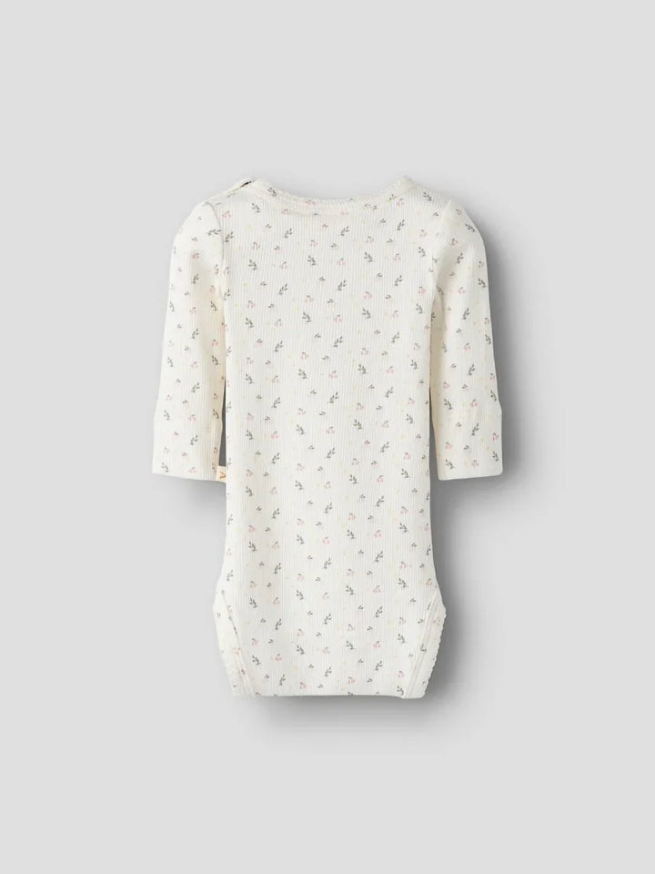 Myk babybody med blomstermønster og lange ermer, perfekt for spedbarn 0-8 år