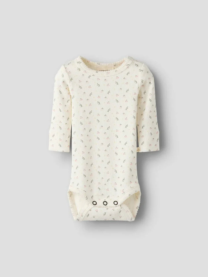 Myk babybody med blomstermønster og lange ermer, perfekt for spedbarn 0-8 år