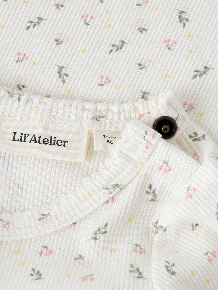 Lil'Atelier babybody med blomstermønster, 1-2 måneder, myk ull og komfortabel passform