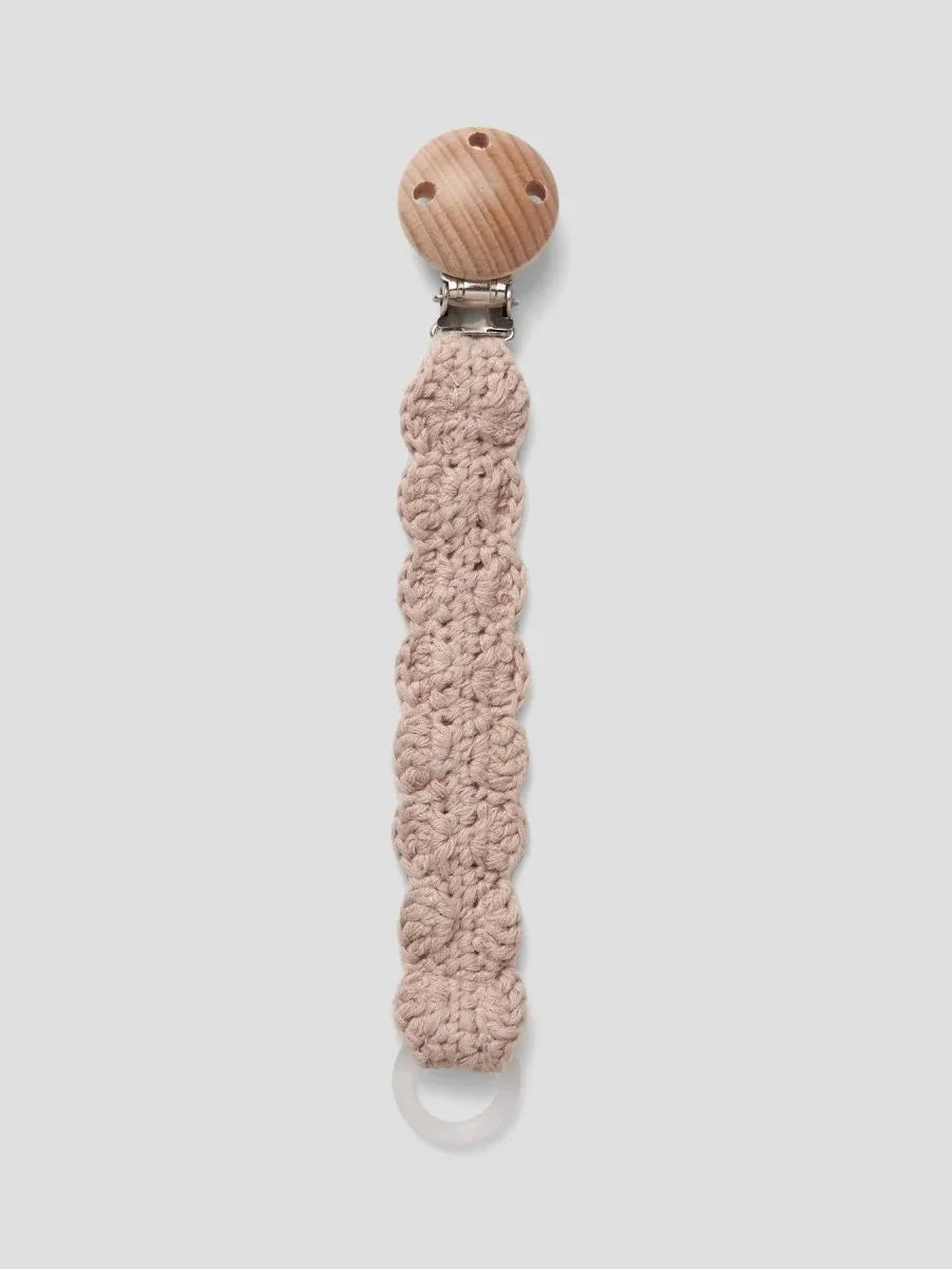 Håndstrikket hakebånd med treknapp for baby, myk ull og bærekraftig design
