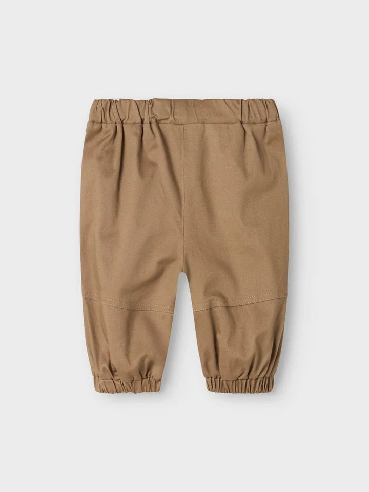 Beige babybukser med elastisk liv og ankel, myke barneklær for små barn