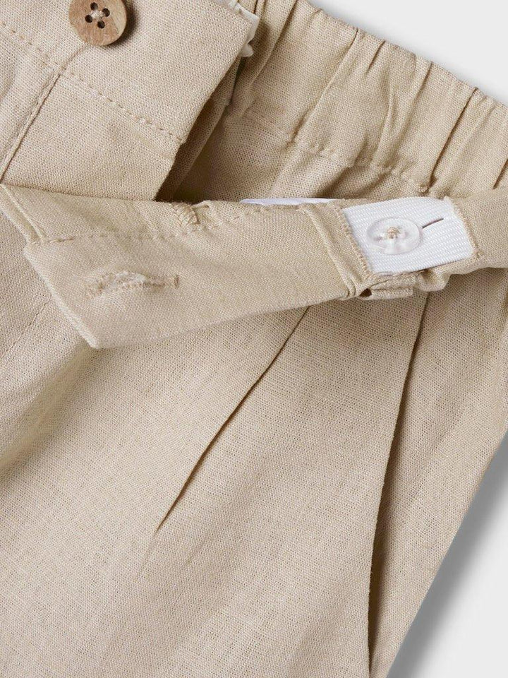 Beige barnetøy med knapp og elastisk liv, myk tekstil for spedbarn og småbarn