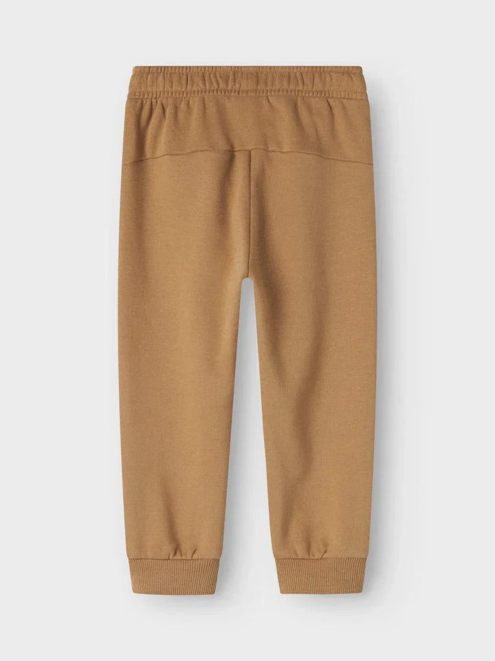 Myke, beige barnetrukker med elastisk liv og ankelbånd, ideelle for bekvemhet og daglig bruk.