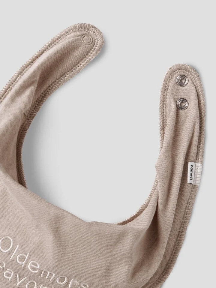 Beige babykjele med trykk og knapper, myk ullklær for spedbarn