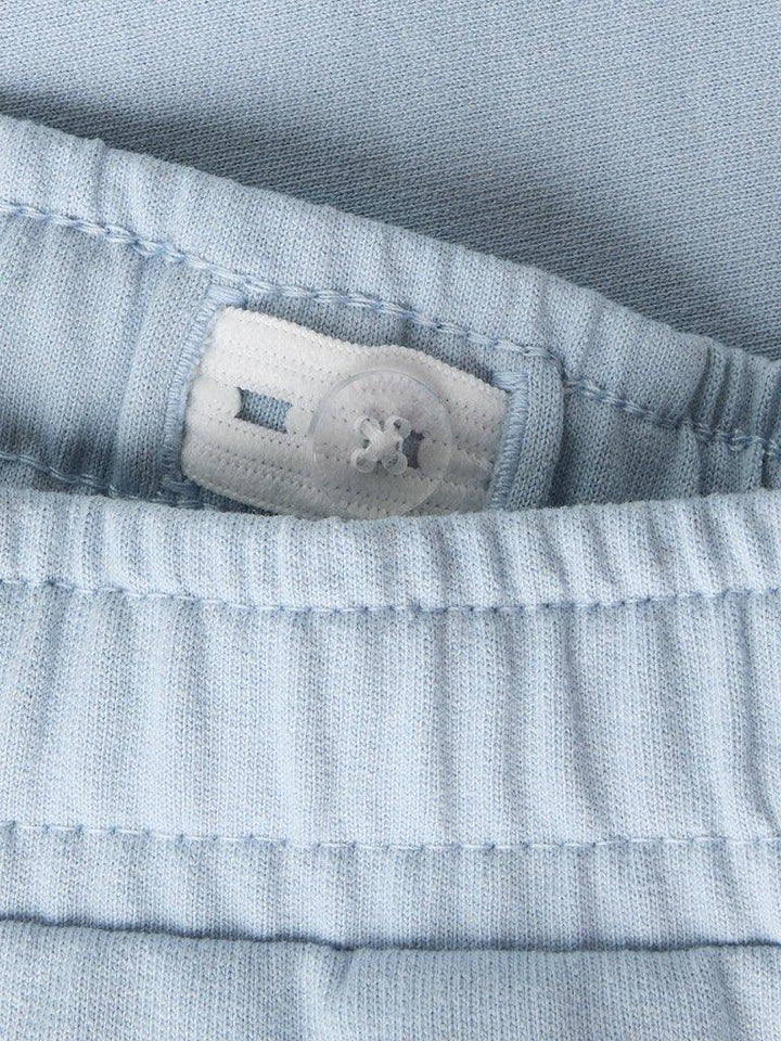 Lysblå barnebukse med knapp og elastisk liv, myk bomull for bekvemhet