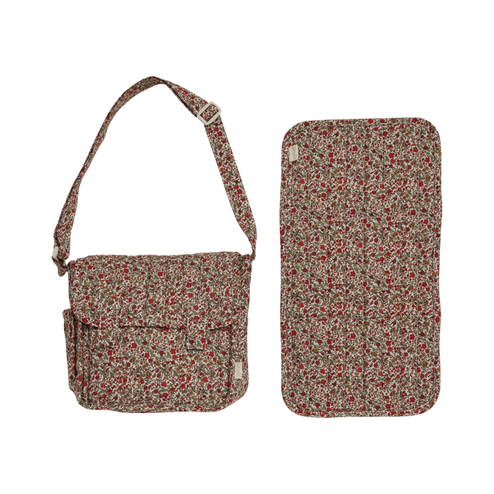 Blomstermønstret barnebag og vaskemåtte i samme design, perfekt for babyutstyr og daglig bruk.