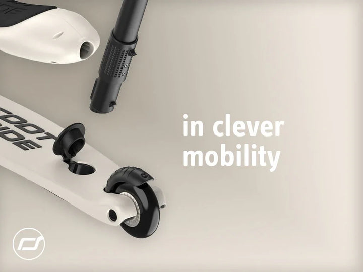 Hvit og svart barne sparkesykkel med justerbart styr og stabil hjul, ideell for trygg mobilitet