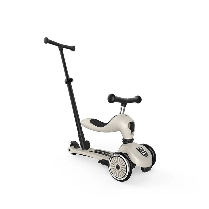 Beige barneskuter med sete og håndtak, perfekt for små barn 1-3 år