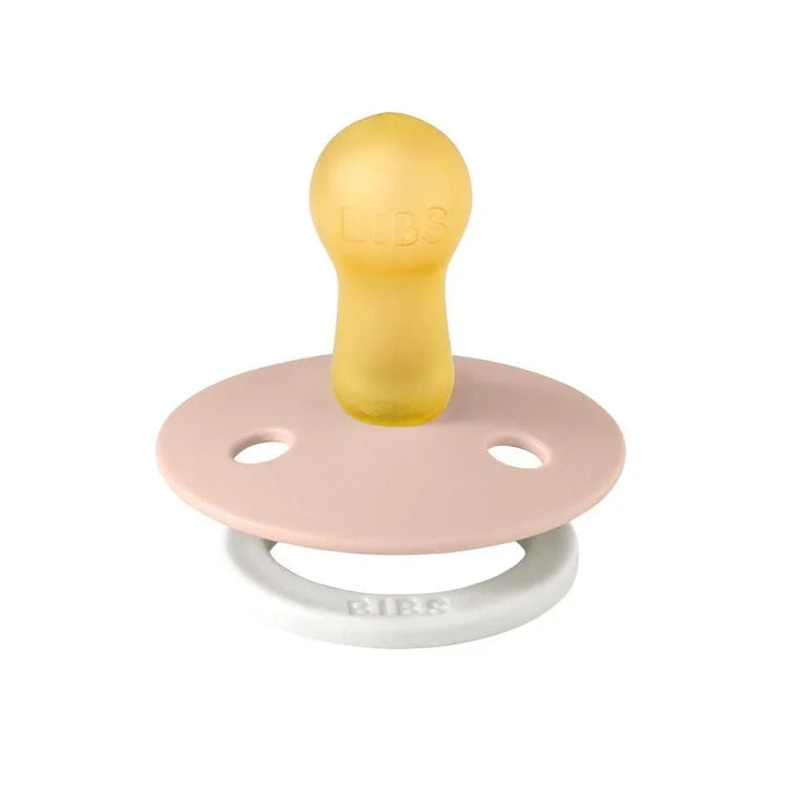 Gul og rosa BIBS babytutt med myk silikon, perfekt for spedbarn og småbarn